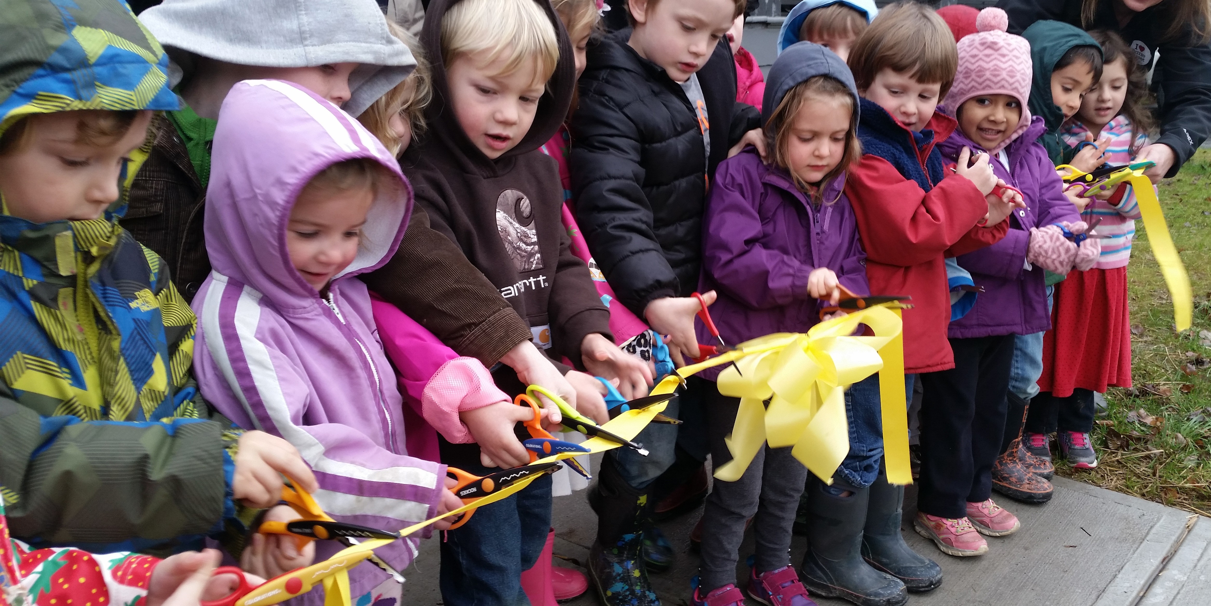 children at a ribbon cutting