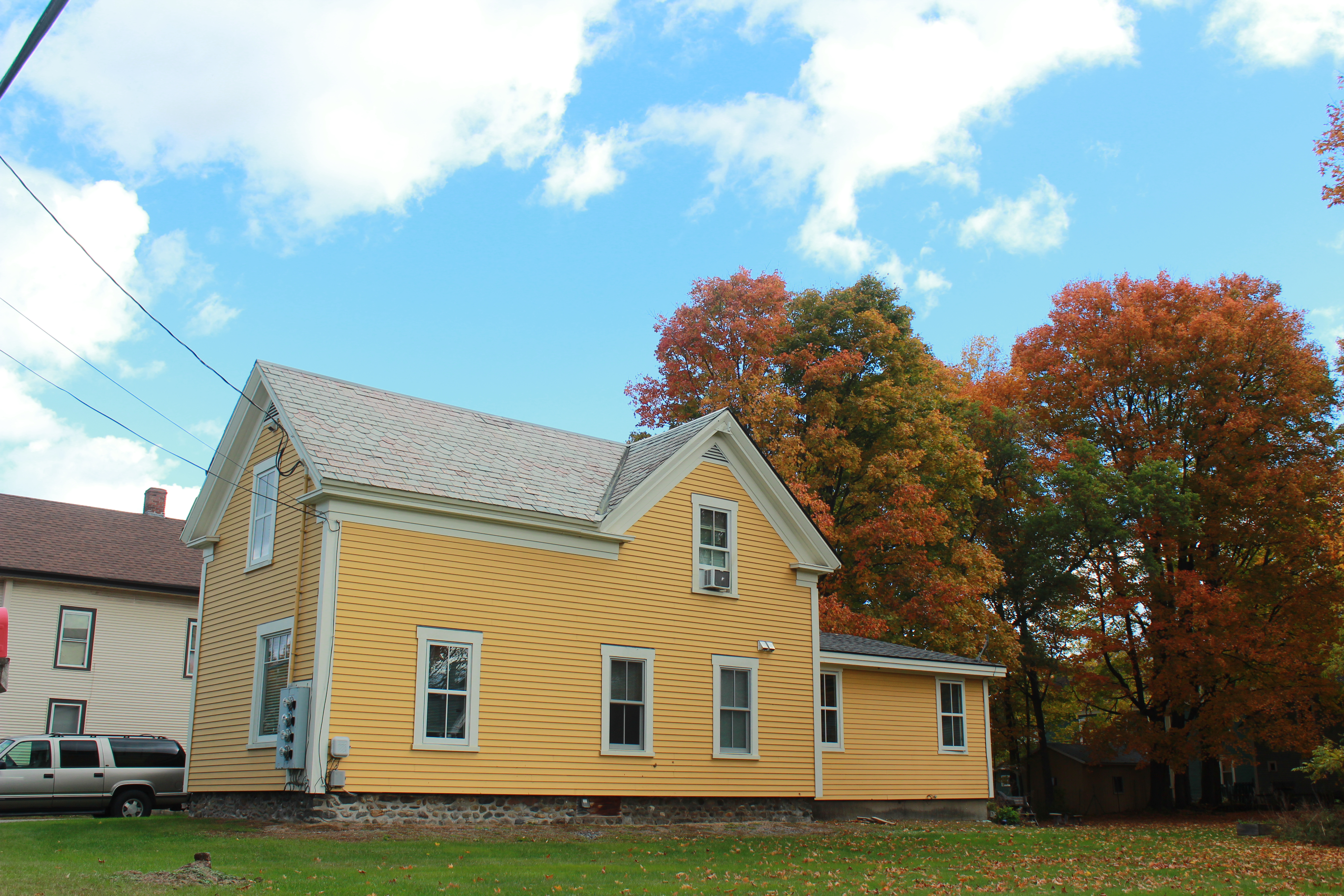 Image of a yellow apartment building in Morrisville 
