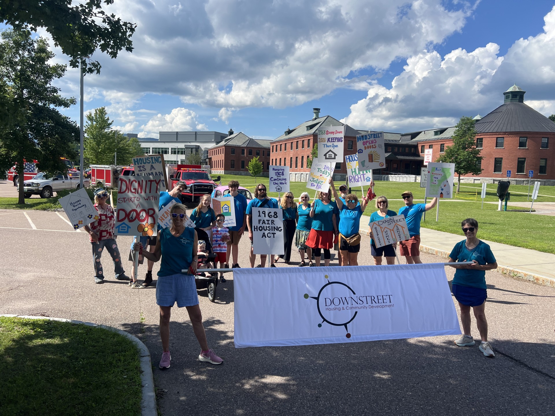 Image of Downstreet staff about to march in a parade 