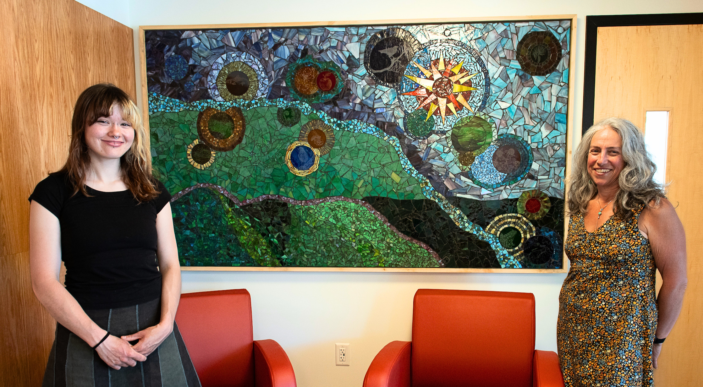 Image of Terry and Anna beside their Marsh House art piece 